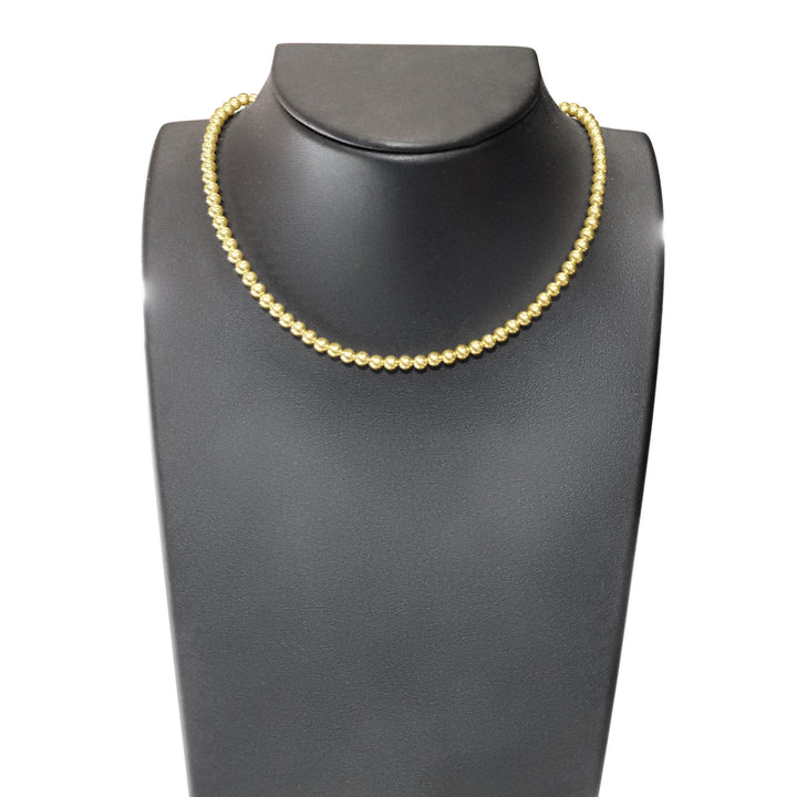 yellow gold necklace with beads