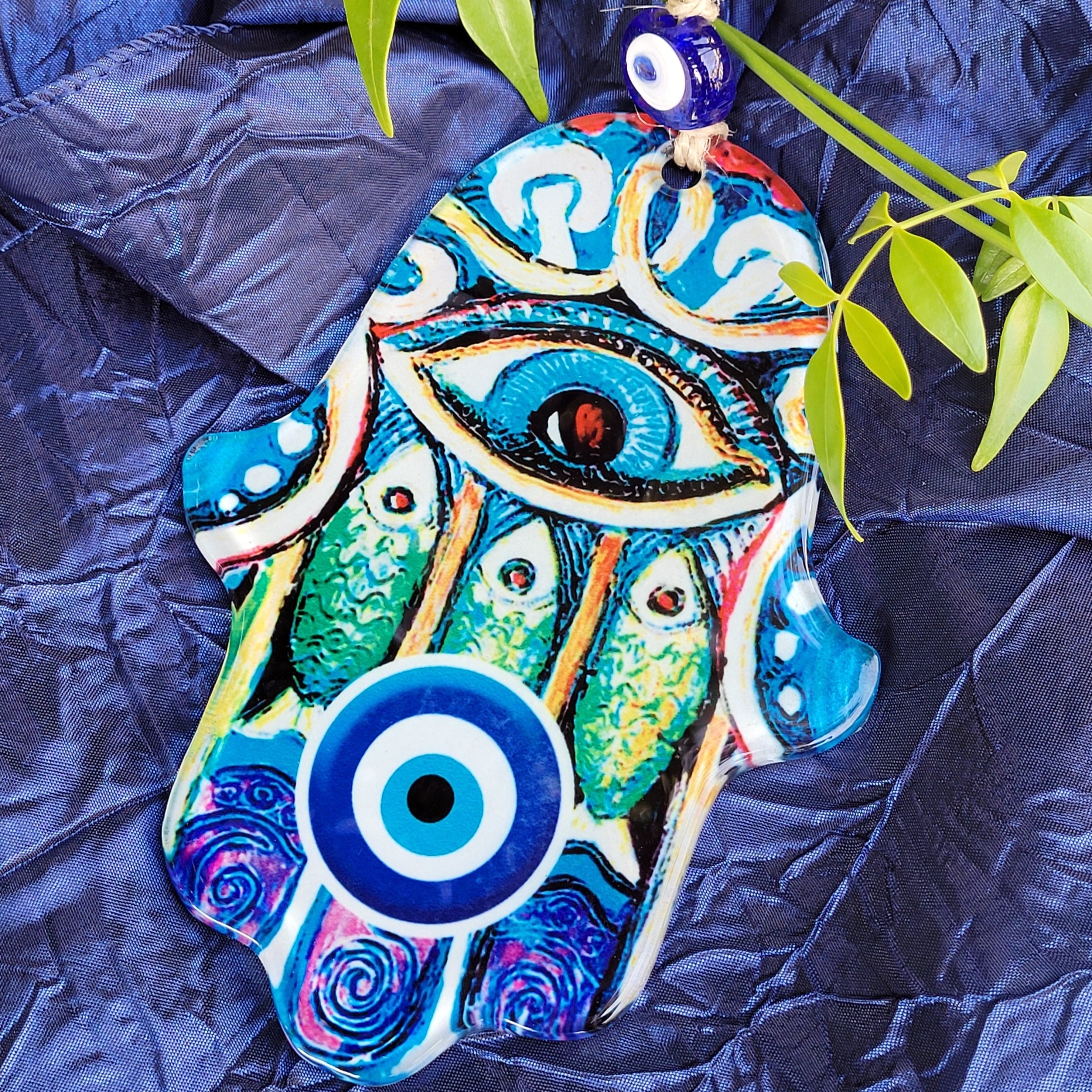protection amulet with eye and fish