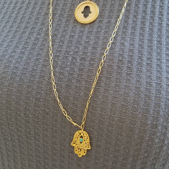 hamsa necklace in gold on paper clip chain
