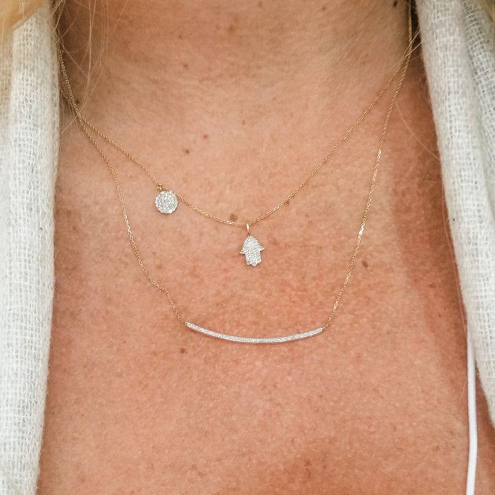hamsa and line of diamond necklace