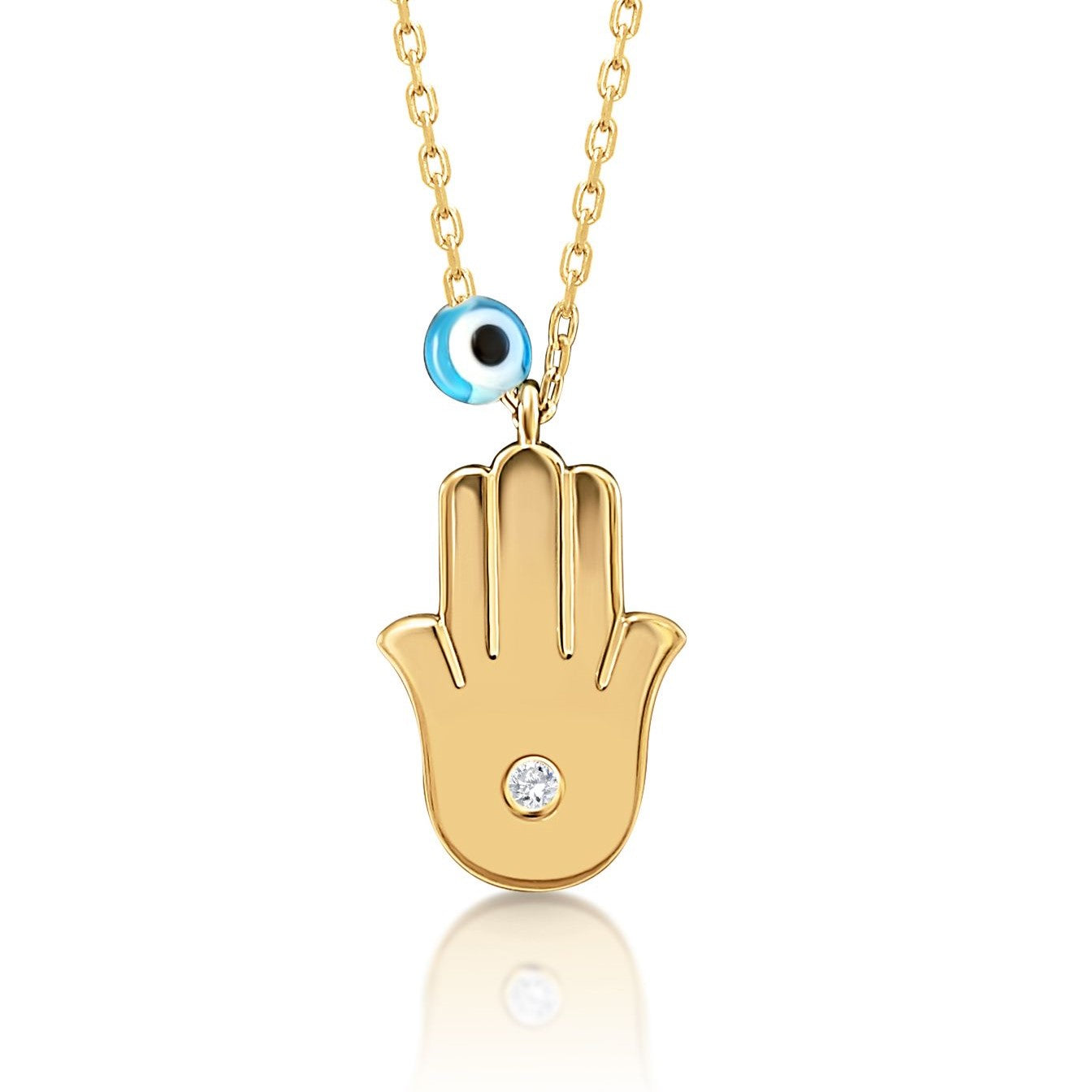 hamsa and evil eye necklace in gold