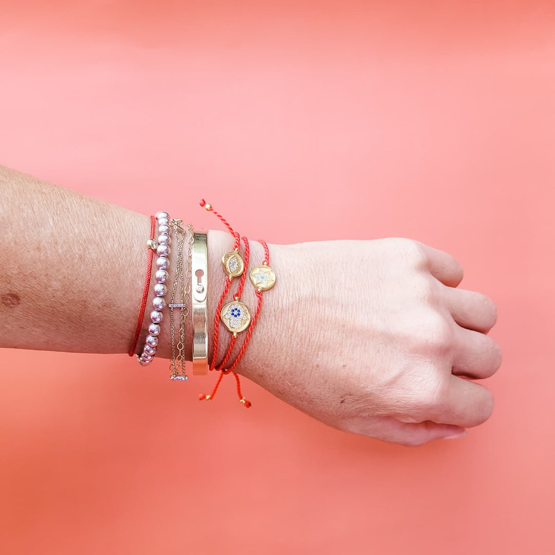 collection red string bracelets