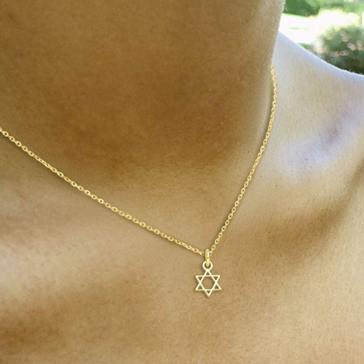 yellow gold tiny jewish star necklace